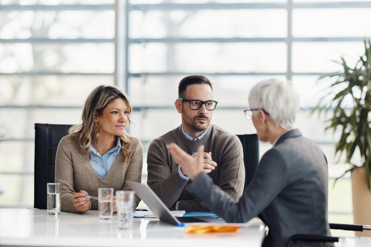 3 professionals talking