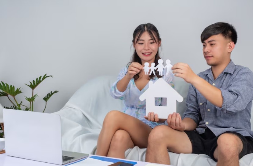 a man and girl holding cutout